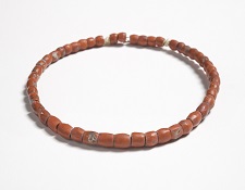Image shows a necklace made of coral beads